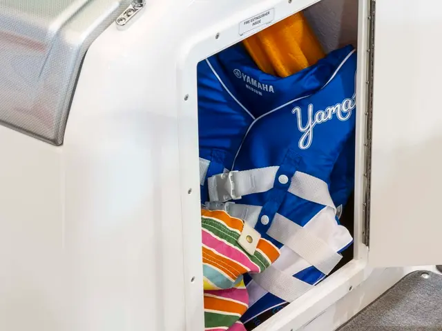 Amanda Holden's fashionable white ensemble, featuring a stylish puff-sleeve blouse and...