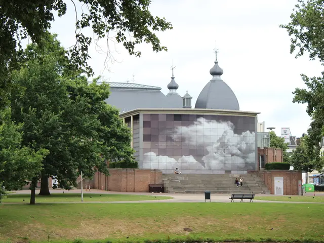 In the image there is grassland in the front with trees on either side and in the back there is a...